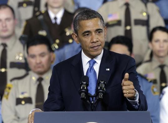 President Obama in Minnesota to promote civilian disarmament (courtesy boston.com)