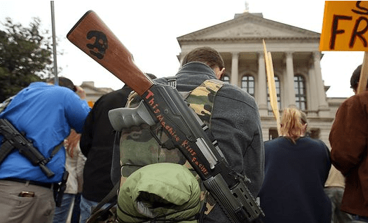 "Demonstrators pray during a pro-gun rally at the main entrance to the Georgia State Capitol on Friday, Feb. 8, 2013, in Atlanta. Groups have been staging similar rallies across the country to protest gun restrictions." (caption and photo courtesy usatoday.com)