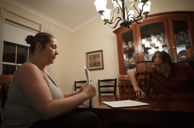 Lynette Phillips, 48, and her husband, David Phillips, 51, sit in their home in Upland, California on March 5, 2013. Lynette, a nurse, had to surrender three guns after spending two days in a mental hospital in December. (courtesy bloomberg.com)