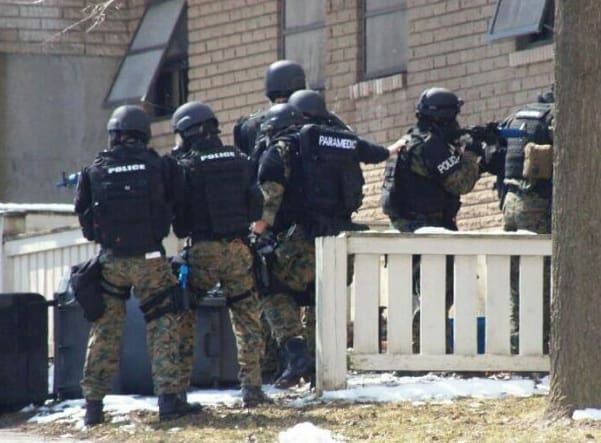 "A photo shared on Facebook of police involved in a hostage training scenario at buildings that are scheduled to be demolished at Ida Yarbourgh Apartments in Albany March 21, 2013. Albany police said they're reviewing training procedures after complaints about the proximity of tear gas and the release of fake ammunition to apartments that are still occupied." (Text and photo courtesy timesunion.com)
