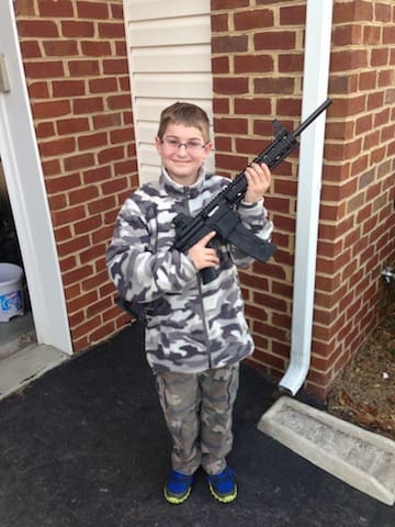 shawnmoore81's son with AR15 (courtesy deloc.org)