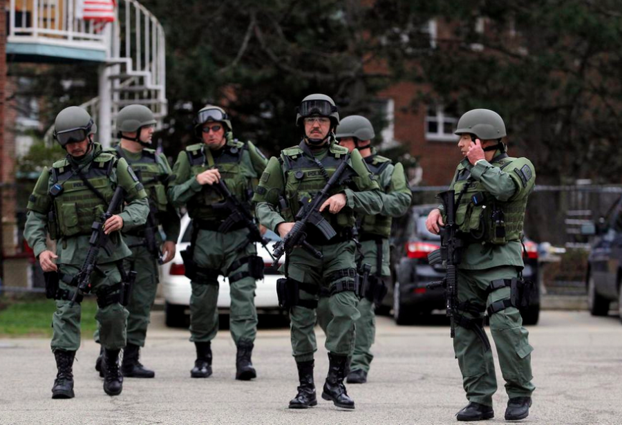 Cops in Boston bomber manhunt (courtesy Reuters)