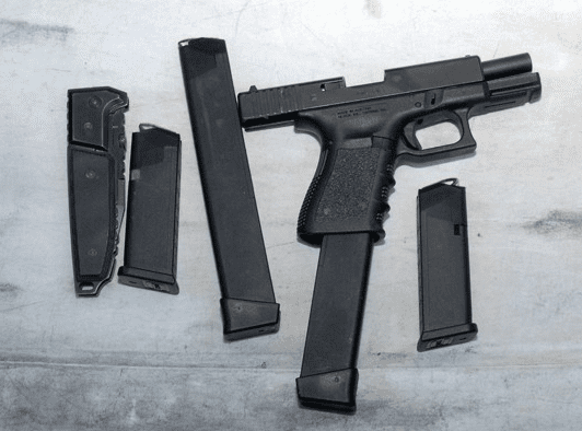 Jared Lee Loughner's Glock and "spare" magazines (courtesy AP)