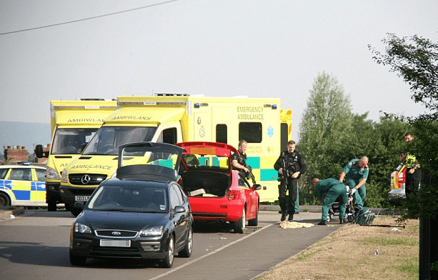 "Incident: Paramedics at the scene where Chris Parry shot dead his estranged wife Caroline next to their two cars with their boots open for a possession swap yesterday." (caption and photo courtesy dailymail.co.uk)