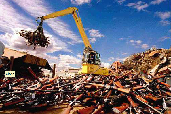 "In this file photo from 1997, piles of guns in Australia are moved after a landmark law that resulted from a mass shooting. Now, Australians are saying the US could learn their lesson." (caption courtesy csmonitor.com. Photo courtesy  Jerry Galea/AP/File)