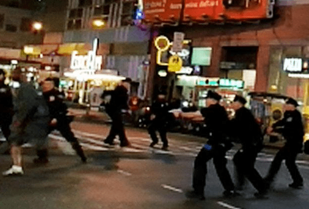 NYPD about to shoot bystanders (courtesy nydailynews,com)