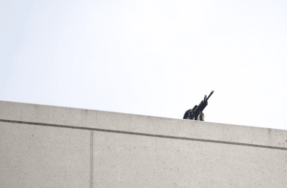 "A sniper is seen securing the surrounding area of the Navy Yard. Astrid Riecken / For The Washington Post"