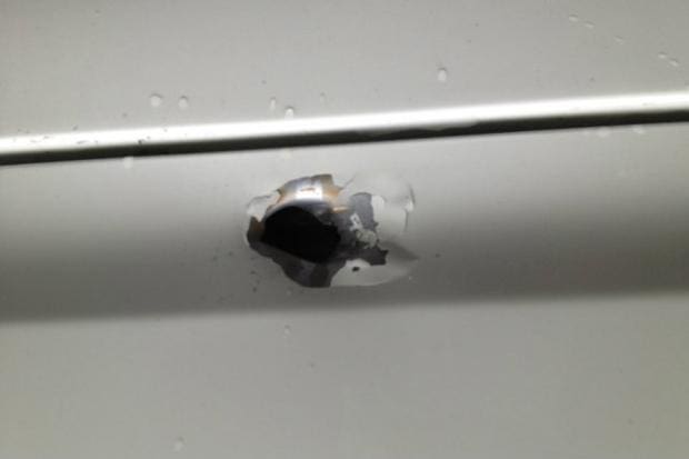 Bullet hole (courtesy dnainfo.com)