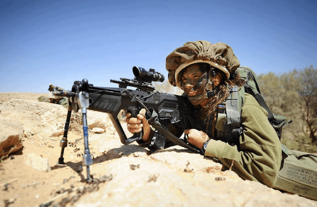 "IDF Women trained as Designated Marksmen. Using the IWI Tavor STAR 21 rifle in 5.56mm (.223) with a Trijicon model ACOG4X32JN8-12 rifle scope with 4 power magnification and a 32mm reticle. This model of the Tavor is issued to IDF Designated Marksmen who's MOS is to support IDF Infantry Platoons." (courtesy IDF Women Facebook page)