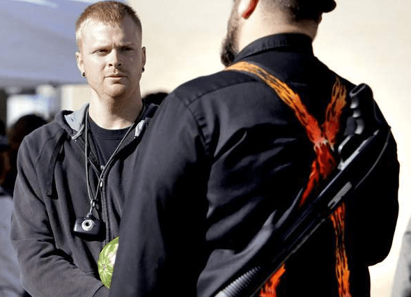 "Open-carry advocate Charles Branstrom (center) of Appleton talks with Bill Polster (right) of Sheboygan Falls while carrying their weapons Saturday, September 21, 2013, at the Downtown Appleton Farm Market." Ron Page/Post-Crescent Media