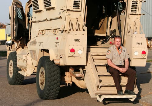 Stutsman County Sheriff Chad Kaiser, sits Thursday with the armored personnel carrier. (courtesy jamestownsun.com)
