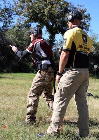A soldier from the U.S. Army Marksmanship Unit (USAMU) teaching marksmanship skills to a member of the USAMU Action Shooting team 