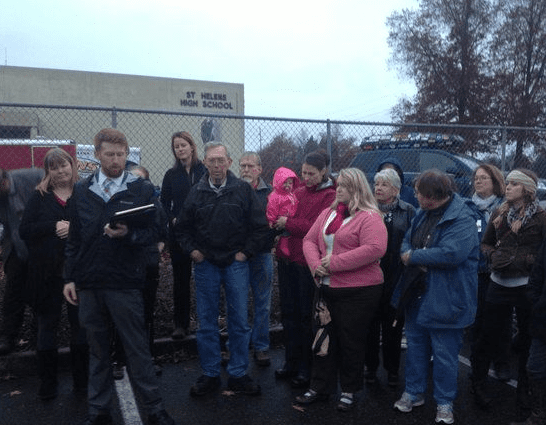 Teachers, parents and students opposed to the St. Helens School Board's decision to lift a gun ban in their district rallied outside the city's high school on Monday. (Shane Dixon Kavanaugh/The Oregonian)
