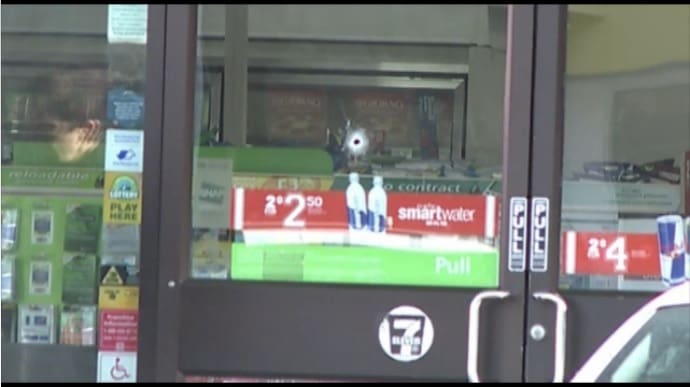 Bullet hole left by police sniper following hostage situation courtesy cbs12.com