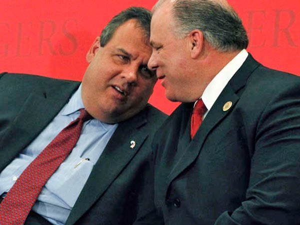 NJ Governor Chris Christie has a quiet word with New Jersey State Sen. President Steve Sweeney (courtesy philly.com)
