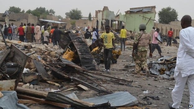 Maiduguri in ruins as a soldier stands guard (courtesy bbc.com)