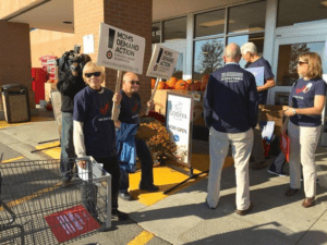 Kristin Moore (far right) and several volunteers stationed demonstrators near entrances of the Kroger at 400 South Maple Road helped get signatures and raise awareness to their Moms Demand Action gun control cause." (Caption courtesy mlive.com. Photo courtesy of Moms Demand Action)