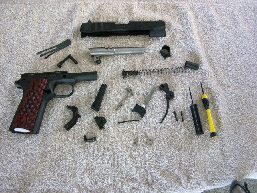 THE COMPLETELY STRIPPED COLT COMMANDER; TAKEDOWN AND ASSEMBLY IS VERY SIMPLE, c Jerry Catania