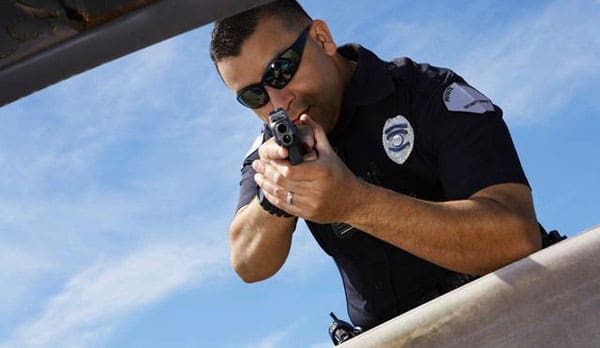 Image result for cop sensing a suspect about to pull out a gun