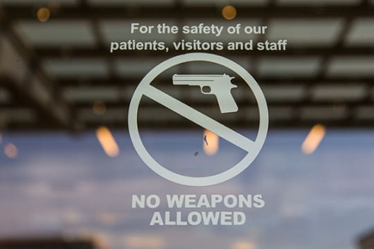 A no weapons allowed sign is posted Aug. 13 at The Children's Hospital, Colorado. Aurora and many other municipalities have almost no restrictions on openly carrying firearms in public, whether the person with the gun is a child or whether the gun is loaded. (Marla R. Keown/Aurora Sentinel)