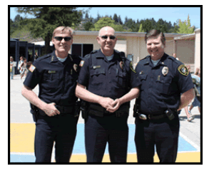 "ormer DARE Instructors Chief John Weiss and Lieutenant John Wilson with then Juvenile Detective Scott Freeman following a 2008 DARE Graduation." (courtesy scottvalleypd.com)