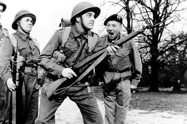 Carry On Sargeant film, Bob Monkhouse (holding rifle and William Hartnell in a scene
