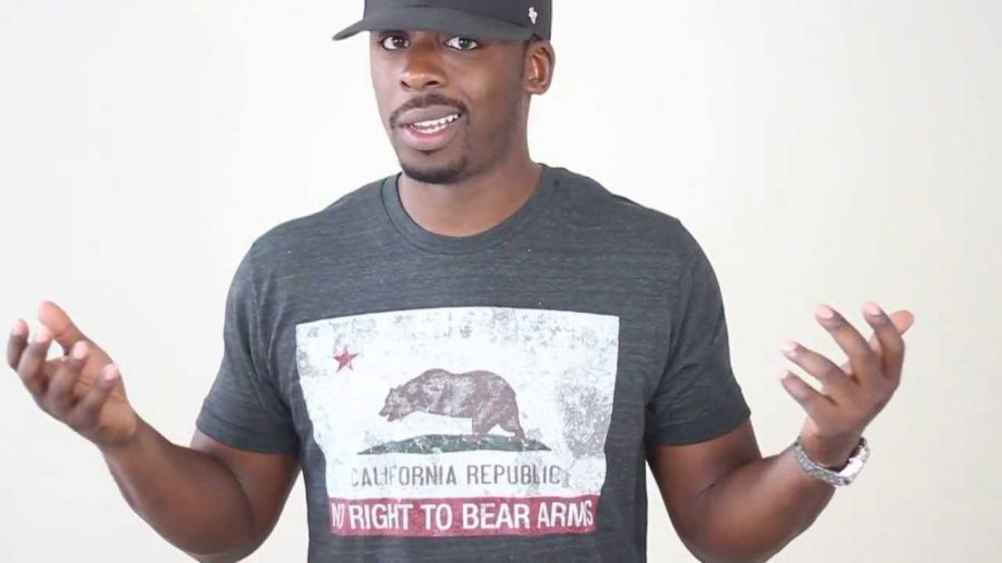 Colion Noir wears a "no bear arms" California shirt 
