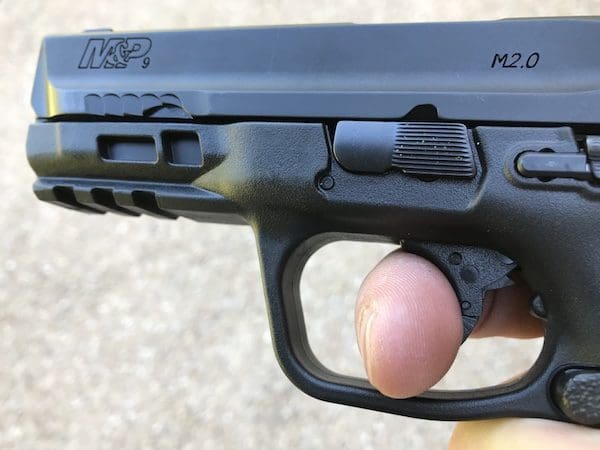 Finger on the trigger of the Smith & Wesson M&P M2.0 Compact (courtesy thetruthaboutguns.com)