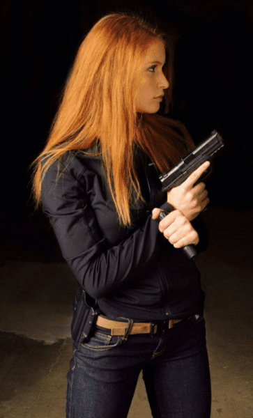 Girl with gun (courtesy oddstuffmagazine.com)