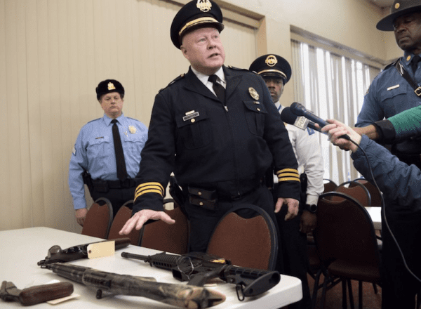 Interim St. Louis police chief Lawrence O'Toole with guns from gun buyback (courtesy stltoday.com)
