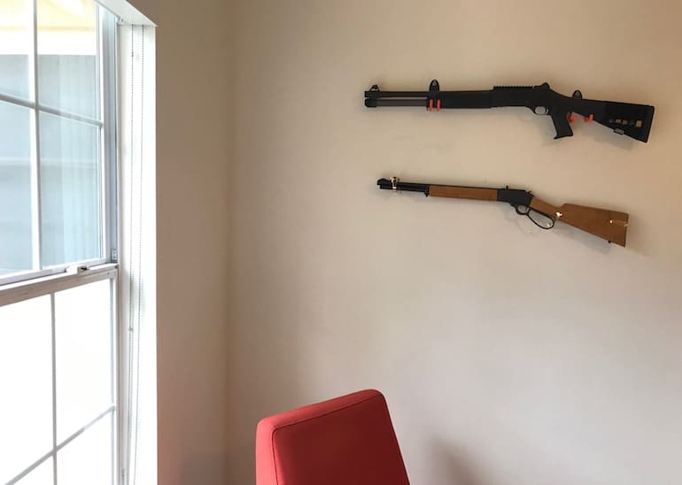 Benelli M4 and Marlin .357 on the wall (courtesy thetruthaboutguns.com)