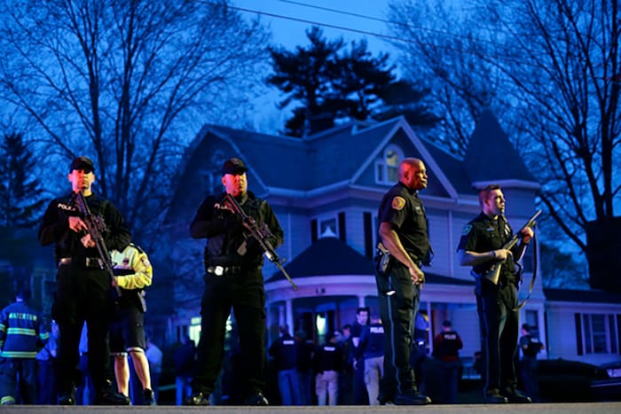 Police officers outside a Victorian style house (courtesy ammoland.com)