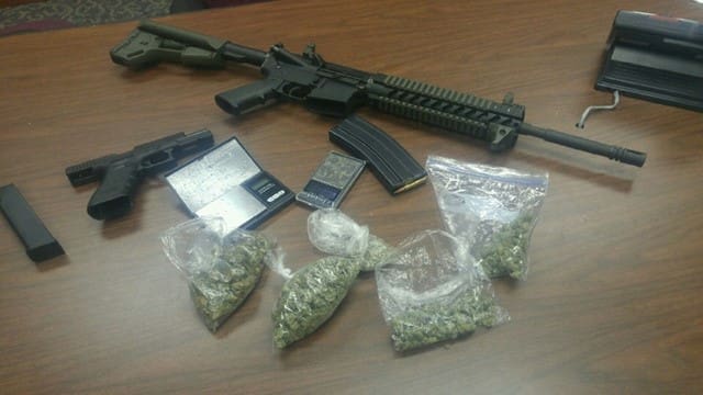 Rifle, handgun, marijuana (courtesy 12newsnow.com)