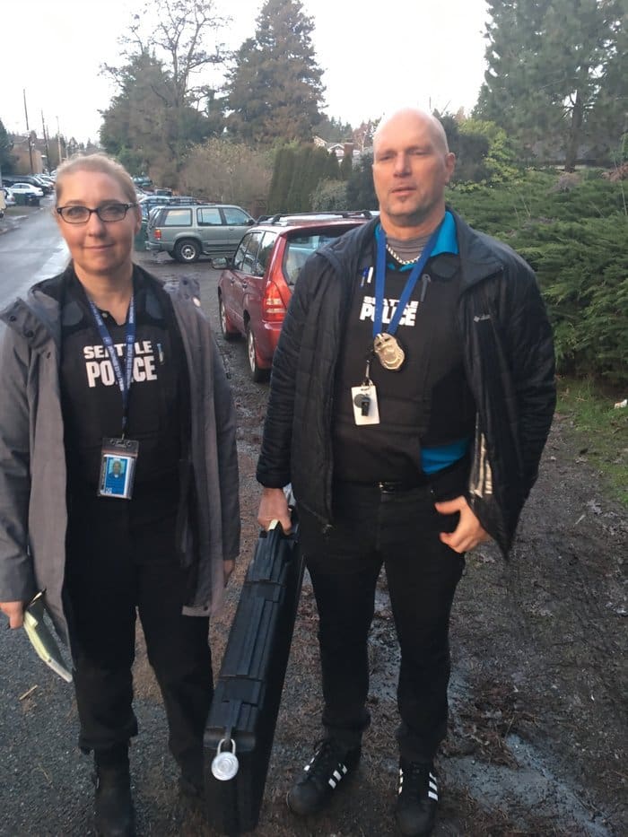 Seattle Police Sgt. Dorothy Kim and Officer Sean Hamlin bag a rifle (courtesy npr.org)