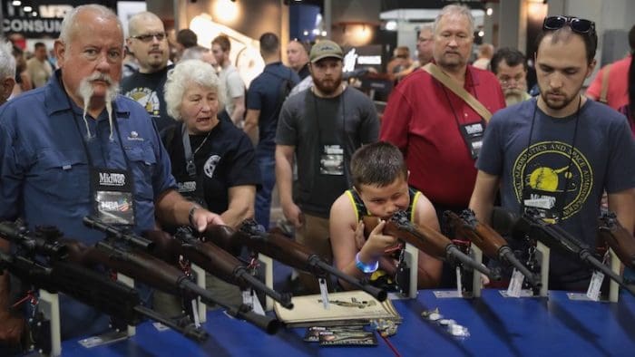 Happy campers athe NRA convention (courtesy thinkprogress.com)