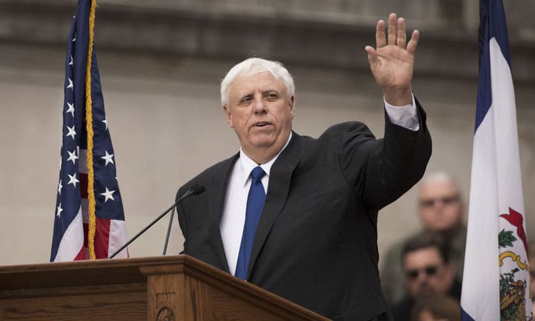 West Virginia Gov. Jim Justice waves to the crowd as he delivers his inauguration speech, Monday, Jan. 16, 2017, in Charleston, W.Va. (AP Photo/ Walter Scriptunas II)