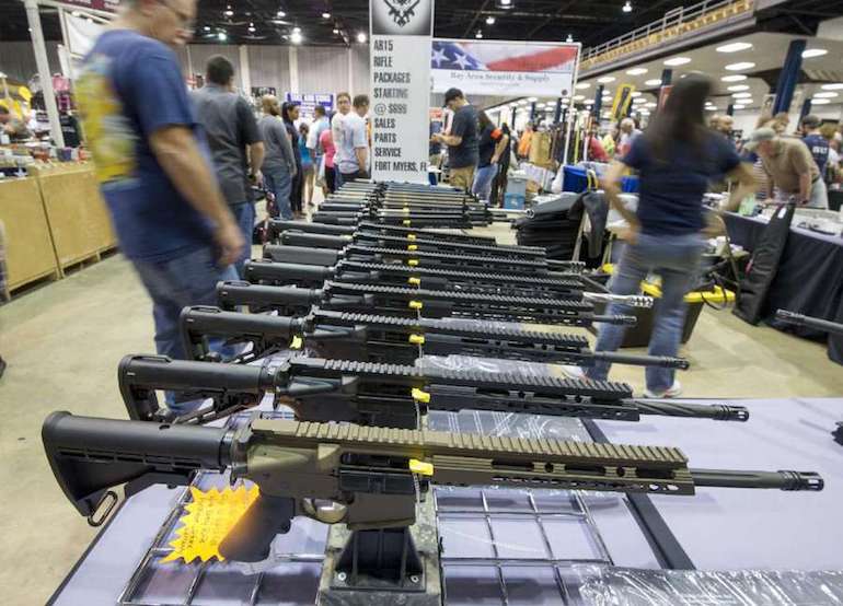 Gun show guns (courtesy tampabay.com)