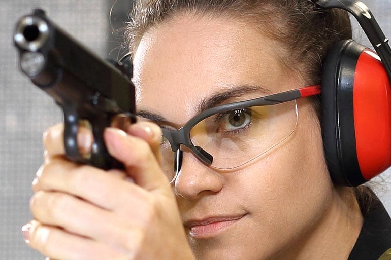 woman gun range pistol