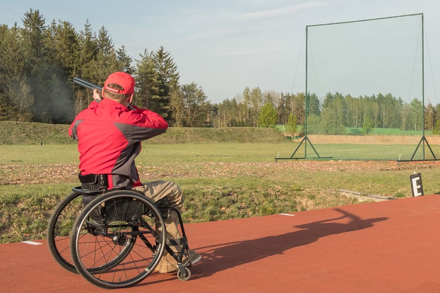 Wheelchair Shoots Skeet On A Trench Stand With A Shotgun Man Ske