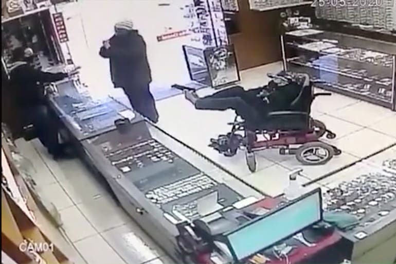 wheelchair robbery gun feet