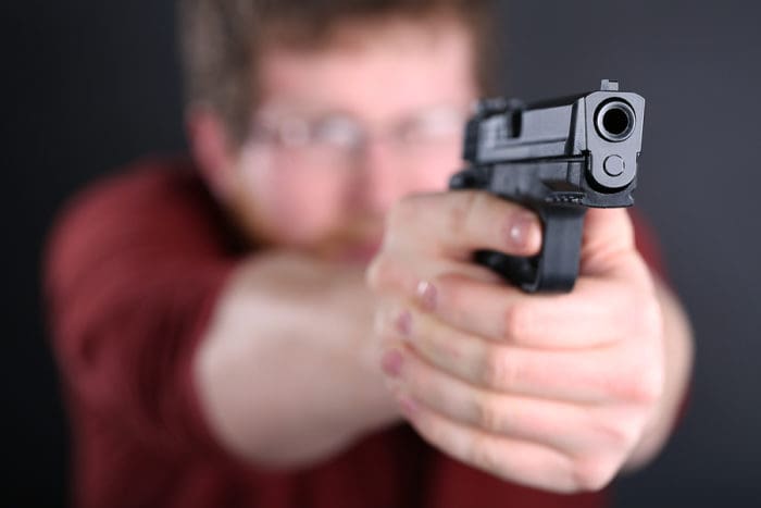 Armed man with gun pistol