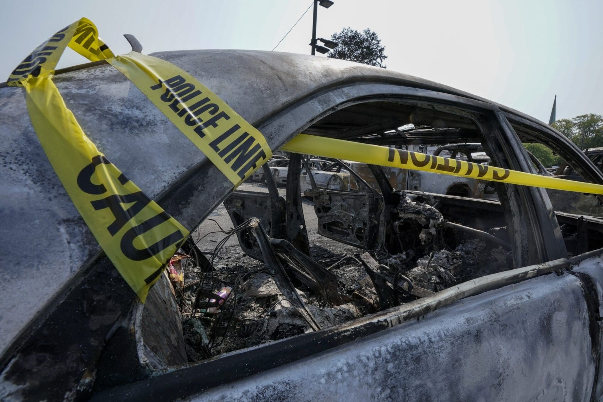 protest vehicle car burned attack