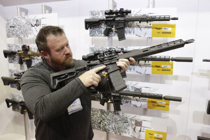 gun conrol laws biden nra convention rifle