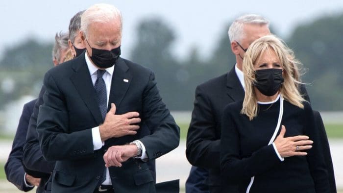Biden dover air force base casket looks at his watch