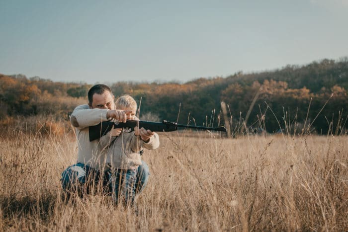 father son hunting rifle teach