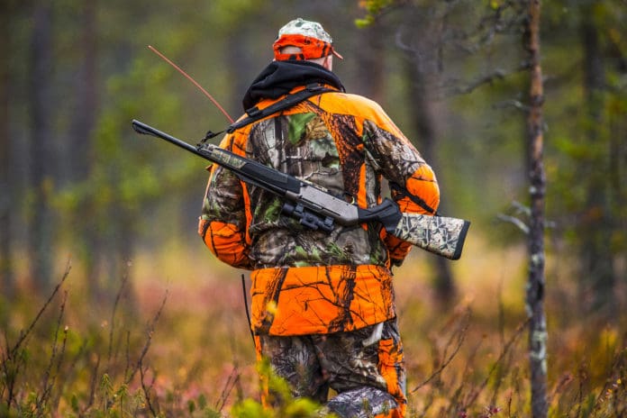 Hunter hunting rifle blaze orange