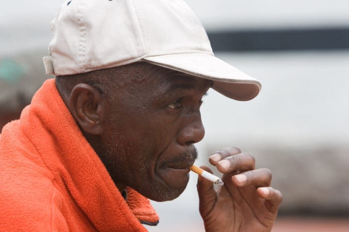 black african american man smoking cigarette