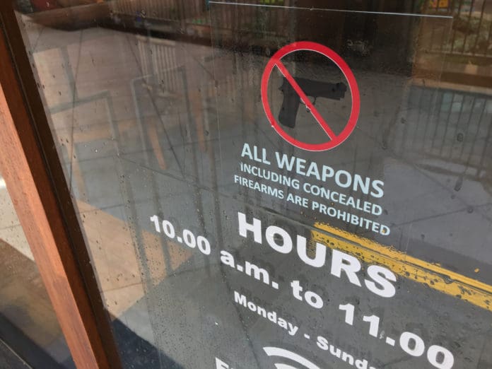 no guns door sign store gun-free