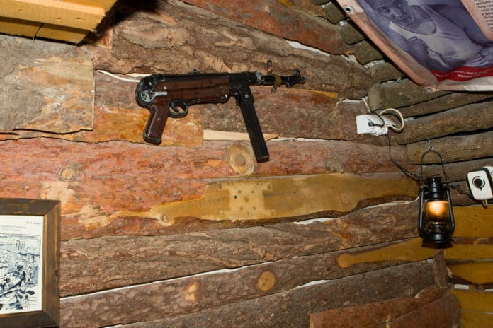 machine gun AK weapon wall