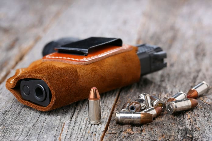 Handgun holster personal defense ammunition